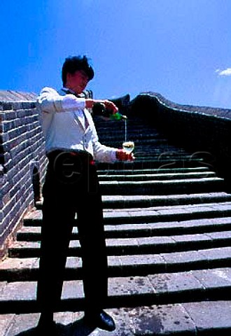 Waiter serving wine on The Great Wall   Beijing China