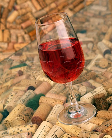 Glass of ros wine with corks
