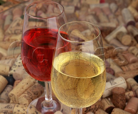 Glasses of white and ros wine with corks