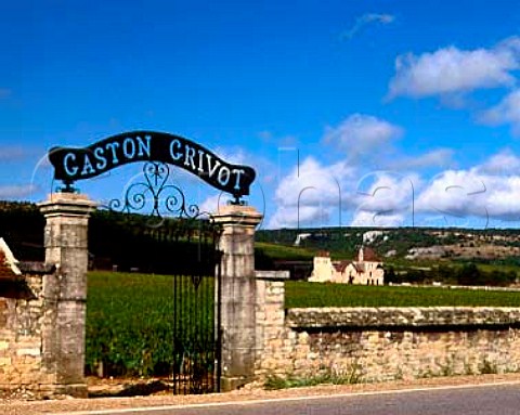 Entrance of Gaston Grivot in the wall of the   Clos de Vougeot with Chteau de la Tour in the   distance Vougeot Cte dOr France  Cte de Nuits
