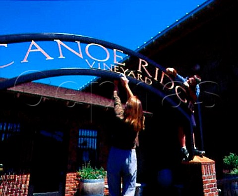 Polishing the winery sign of Canoe Ridge Vineyard    owned by the Chalone Wine Group   Walla Walla Washington USA