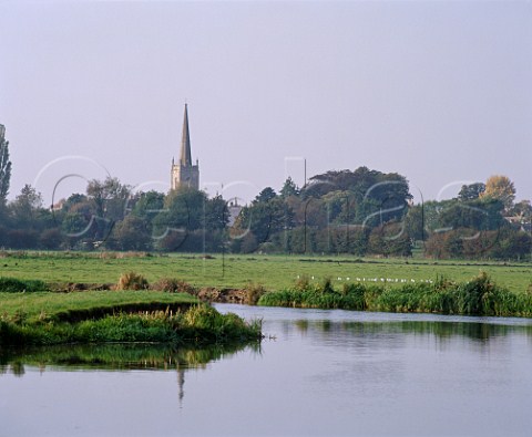 St Lawrence Church and the River Thames at   Lechlade Gloucestershire England