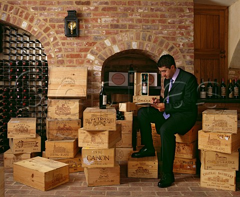 Vincent Gasnier Master Sommelier  cataloguing wines in a clients cellar