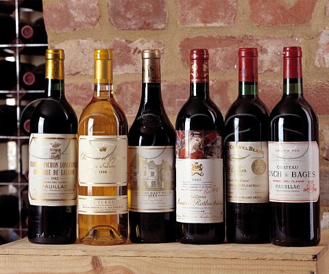 Bottles of Cru Class Bordeaux in a wine cellar  PichonLalande 1982 Yquem 1990 HautBrion 1985   Mouton Rothschild 1985 Cheval Blanc 1970   LynchBages 1982