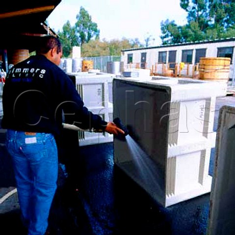 Hosing down grape crates at Robert Mondavis   Carneros Winery Napa California