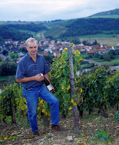 Helmut Dnnhoff with bottle of his Riesling Kabinett in Hermannshhle vineyard of Weingut Hermann Dnnhoff Niederhausen Germany  Nahe