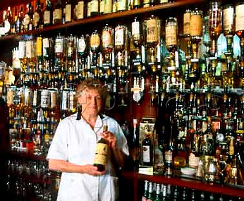 Wilma McBain owner behind the bar of The Grouse   Inn  over 800 varieties of whisky are stocked  Cabrach Moray Scotland