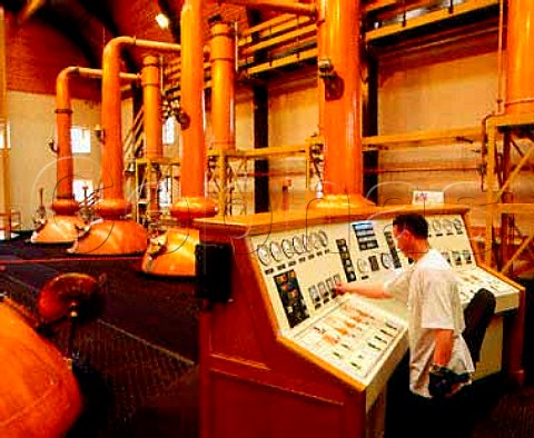 Stillman James Morrison operating the control panel   in the still room of Glenmorangie whisky distillery   Tain Rossshire Scotland  Highland