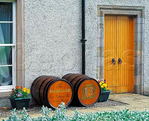 Decorative barrels outside the 17th century manor house of Macallan whisky now used as their offices Banffshire Scotland
