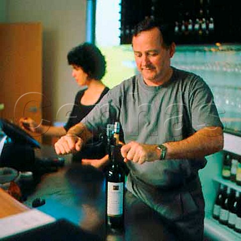 Tony Forsyth opening a bottle in the tasting room of   Te Whau Vineyard Waiheke Island New Zealand