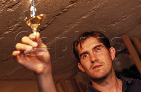 JeanLaurent Vacheron with glass of   Sauvignon Blanc taken from barrel in the   cellars of Domaine Vacheron Sancerre   Cher France
