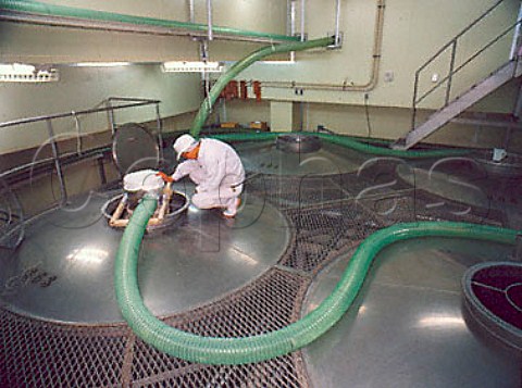 Blowing freshly steamed rice into the fermentation   tanks Shikomi tanks  Sawanoi Sake Brewery    Sawai Tokyo