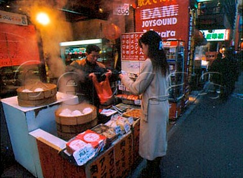 Shop selling Nikuman steamed dumplings in Chukagai   Dori avenue  Chinatown district  Yokohama  Japan