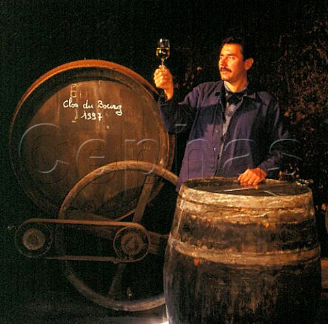 Jean Bernard Berthome chef de viticulture with a   glass of Clos de Bourg taken from barrel in the   cellars of Gaston Huet   Vouvray IndreetLoire France