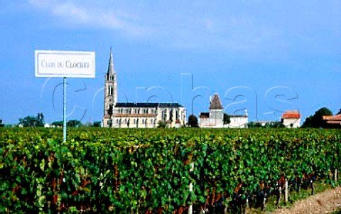Pomerol church viewed over Clos du   Clocher vineyard Gironde France   Pomerol  Bordeaux