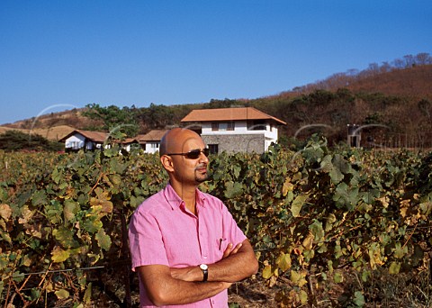 Rajeev Samant owner of Sula Vineyards    with his winery and house beyond  Nasik Maharashtra province India