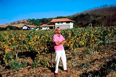 Rajeev Samant owner of Sula Vineyards    with his winery and house beyond  Nasik Maharashtra province India