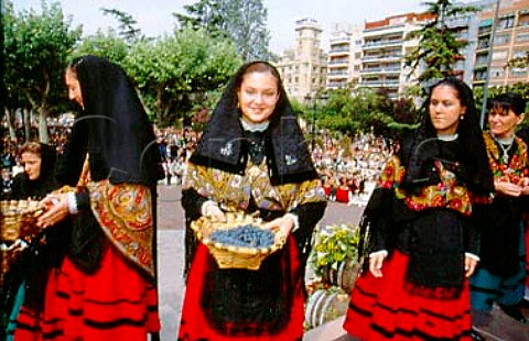 Chosen Logronians with baskets of grapes   which they empty into a barrel  for the   ceremonial treading of the grapes during   the Festival of San Mateo in Logroo    La Rioja Spain   Rioja