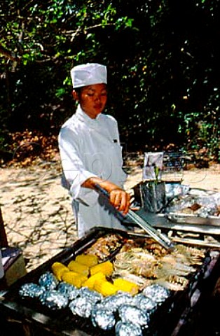 Cooking seafood on the beach   Kota Kinabalu Borneo Malaysia