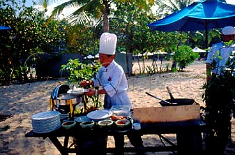 Chef cooking breakfast on the beach   Borneo Malaysia
