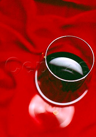 Glass of red wine on velvet
