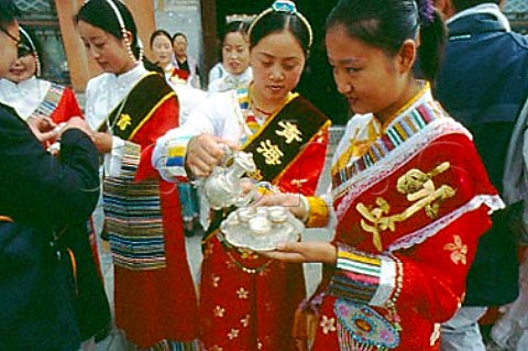 Barley wine drinking ceremony to welcome   visitors to the Tibetan temple at    Qinghai China