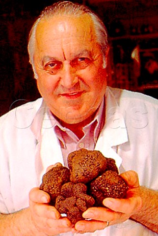 Shop owner with local black truffles   Nrcia Umbria Italy