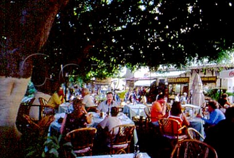 Outdoor restaurant tables on old Rhodes   town Greece