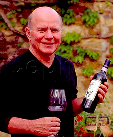Frank Grace owner with bottle of   Il Molino di Grace  Panzano in Chianti Tuscany Italy     Chianti Classico