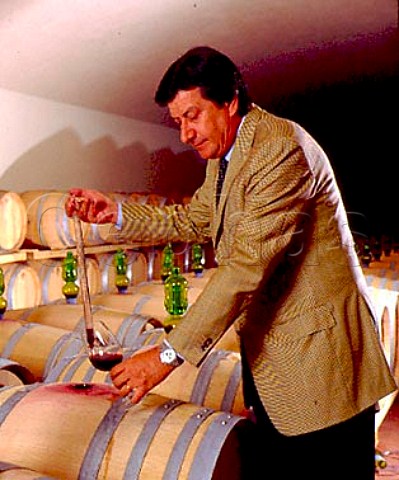Franco Bernabei consultant winemaker taking a   sample from barrel in the chai of   Il Molino di Grace Panzano in Chianti Tuscany   Italy  Chianti Classico