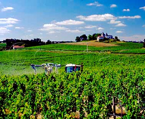 Spraying in vineyard below Chteau Lague Gironde   France  Fronsac  Bordeaux