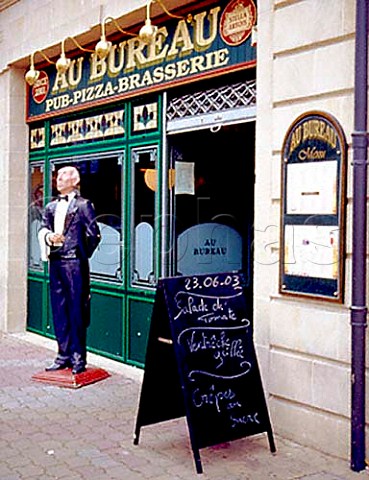 Menu board and model waiter outside a brasserie on Rue de la Rsistance Bergerac   Dordogne France