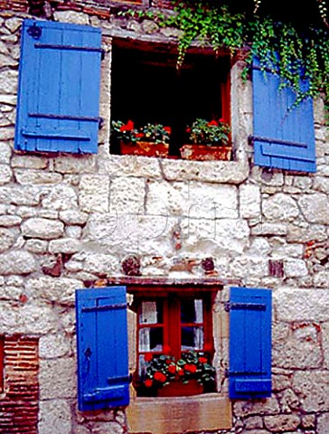 Window with shutters and flower box on   Place de la Mirpe Bergerac Dordogne France
