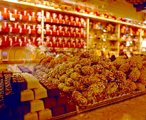 Hand made chocolate truffles on display in   Pralinette Wollestraat Bruges Belgium