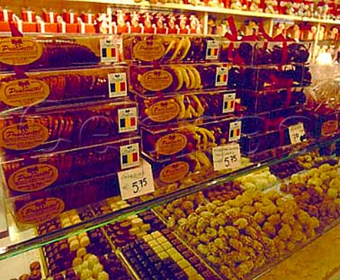 Hand made chocolate truffles on display in   Pralinette Wollestraat Bruges Belgium