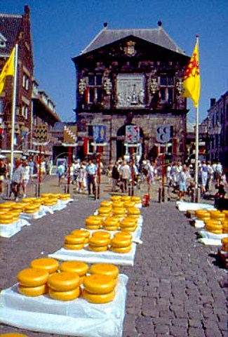 Cheeses in the Market Place in front of   the Waag Weighhouse   Gouda  Netherlands