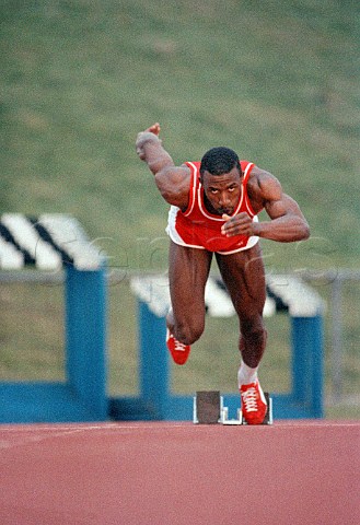 Linford Christie sprinting from starting blocks