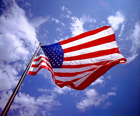 American flag flying against blue sky