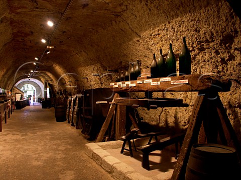 Display of wine bottle sizes in one of the  many caves dug into the soft tuffeau rock at MontlouissurLoire  IndreetLoire France   AC Montlouis