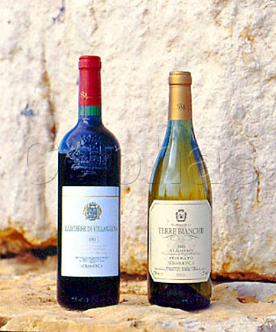 Bottles of Marchese di Villamarina and Terre Bianche   wines standing on rocks that were excavated prior to   the vineyard planting     Sella  Mosca Alghero Sardinia Italy