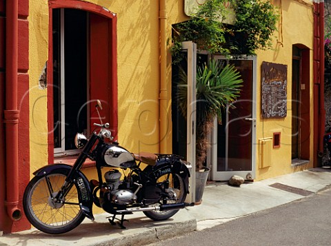Old motorbike outside La Zouave restaurant  Collioure PyrnesOrientales France
