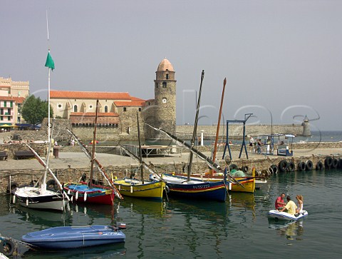 Brightly painted traditional fishing boats in    Collioure harbour   PyrnesOrientales France