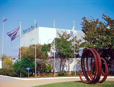 The sculpture Ligne Indtermine displayed in the   courtyard of Robert Skalli winery is reproduced on   his bottle labels  The bottling plant of Fortant de   France can be seen behind  Ste Hrault France   Languedoc