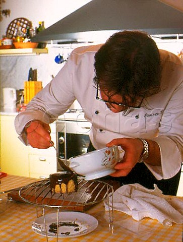 Chef Francesco Roccato making Ganache Cake   hazelnuts torrone nougat and chocolate  Piemonte Italy