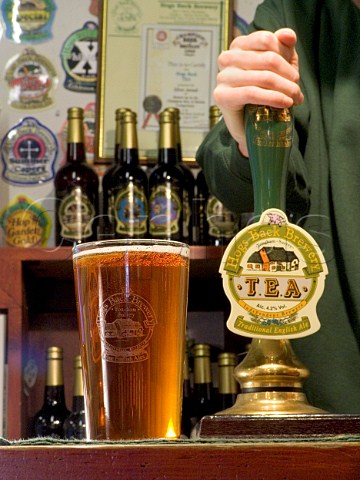 Pulling a pint of beer at the Hogs Back Brewery Tongham Surrey England
