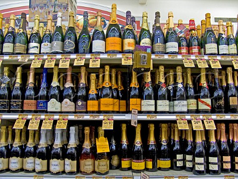 Bottles of Champagne and American sparkling wines on   shelves of supermarket California