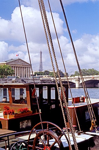 Rigging on french barge on River Seine with the  Eiffel Tower beyond Paris France