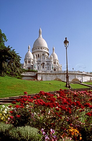 Sacre Coeur Cathedral with spring flowers in   foreground Paris France