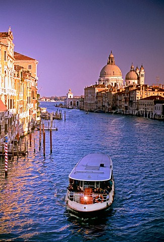 Grand Canal with Vaporetto waterbus and the dome of   Basilica di Santa Maria della Salute behind Venice   Italy