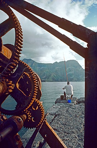 Rusting boat winch and fisherman  Gran Canaria   Spain